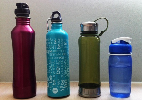 Four Reusable Water Bottles Made From Different Materials