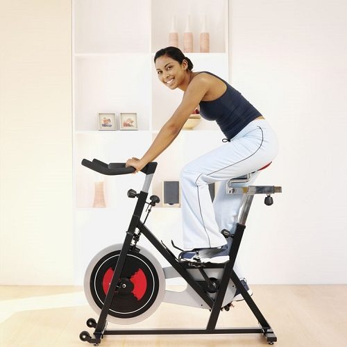 Woman Riding an Indoor Spinning Bike